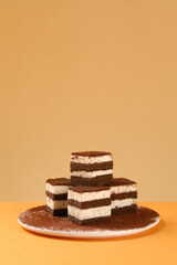 Square shaped tiramisu, chocolate cocoa layer cake