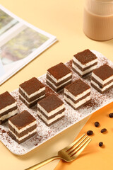 Square shaped tiramisu, chocolate cocoa layer cake