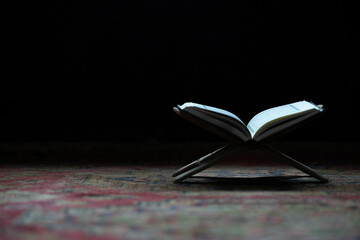 Quran in the mosque - open for prayers Prayers of Muslims around the world placed on a wooden board...