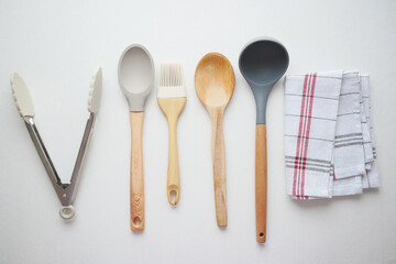  wooden cutlery fork and spoon on a chopping board on table 