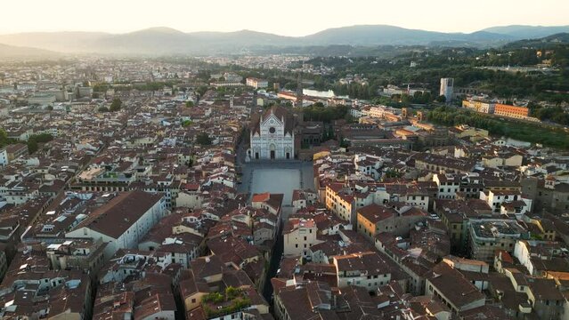 Aerial view of Basilica of Santa Croce in Florence and Piazza di Santa Croce at sunset, Tuscany, Italy