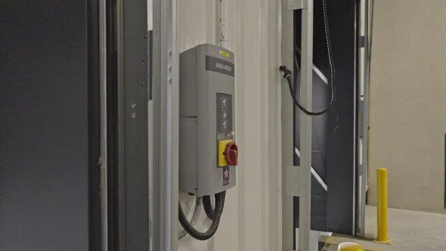 Door Panel of Loading Dock Bay Door in Warehouse Distribution Center. 4k 50fps