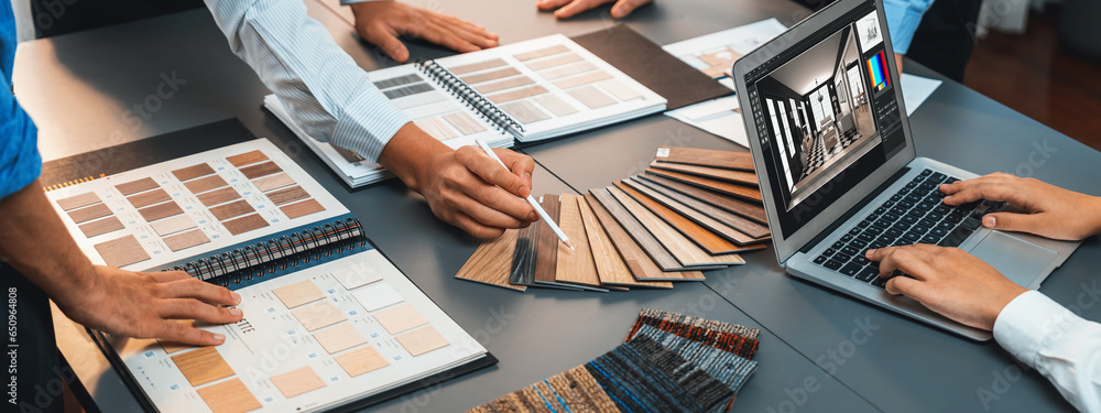 Poster group of interior architect designer team at table choosing various mood board samples with architec