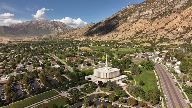 Aerial Provo Utah LDS temple Mount Timpanogos pull. Temple of The Church of Jesus Christ of Latter-day Saints, LDS or Mormon religion. Christian religious groups. Sacred for eternal worship.
