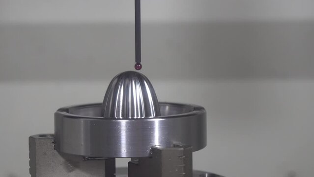 The operation of CMM machine measuring the sample parts.