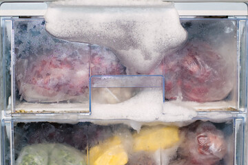 Defrosting the refrigerator. defrosting the freezer. Ice froze in the freezer because the door was not closed. - 650974008