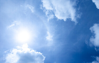 Naklejka na ściany i meble The vast blue sky and clouds sky on sunny day. White fluffy clouds in the blue sky.