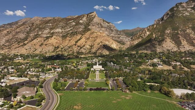 Aerial Provo Utah LDS temple mountain valley forward 1. Temple of The Church of Jesus Christ of Latter-day Saints, LDS or Mormon religion. Christian religious groups. Sacred for eternal worship.
