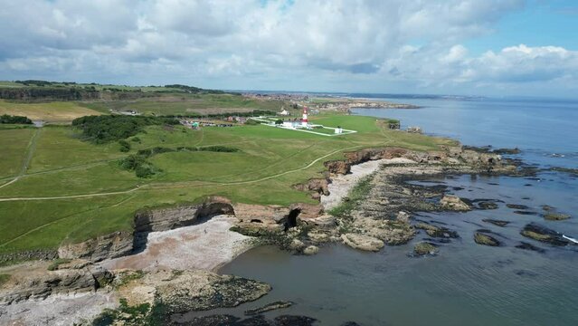 Aerial drone shot of Souter Lighthouse and sea coastline Sunderland North East England. South Sheilds, Marsden and Whitburn. Drone remains static. 4K