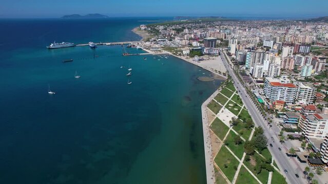 Vlora's Charming Promenade: A Coastal City in Albania Boasting a Beautiful Turquoise Sea Lagoon and a Bustling Port Attracting Tourists