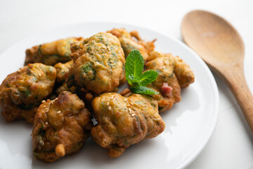 Fried fritters with ham and spinach