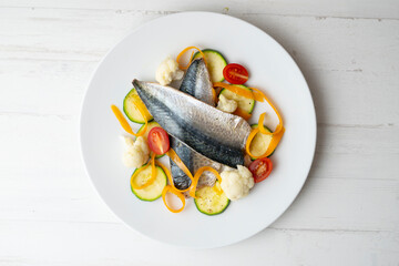 Steamed mackerel with cauliflower and other seasonal vegetables.