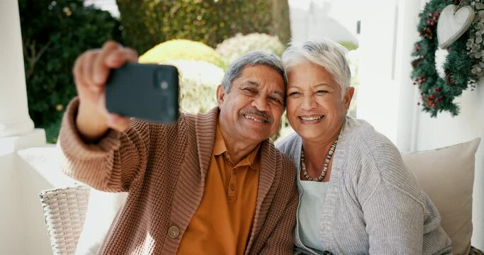 Selfie, happy and a senior couple in a garden for social media, bonding and a memory. Smile, technology and an elderly man and woman taking a photo on a mobile on a backyard home sofa for love