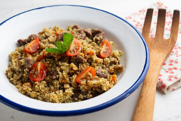 Couscous with vegetables and beef marinated with fresh mint.