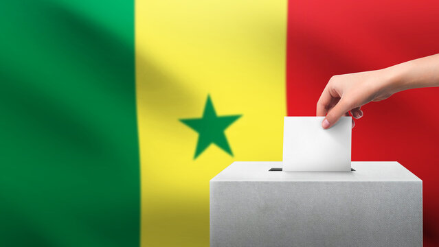 Woman puts ballot paper in voting box on SENEGAL flag background. Election concept.