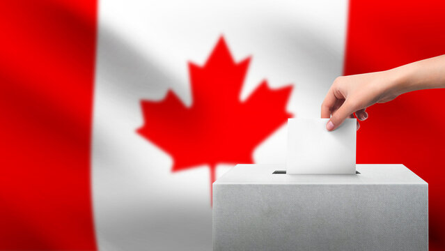 Woman puts ballot paper in voting box on Canada flag background. Election concept.
