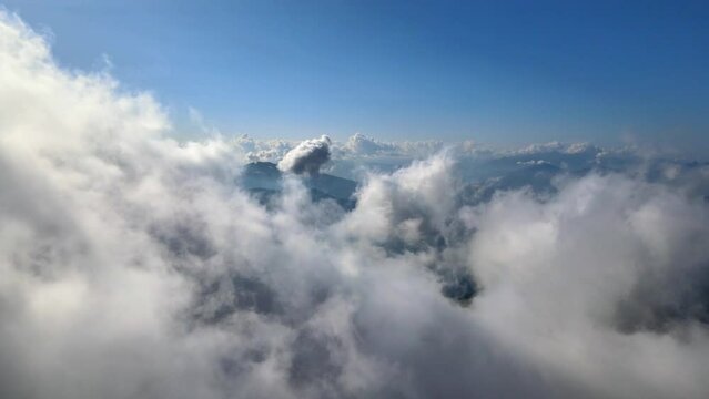 Flying through the clouds and over mountains