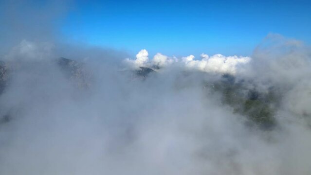 Flying through the clouds and over mountains