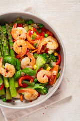 Stir fried shrimps with asparagus, vegetables. Cooked healthy food.