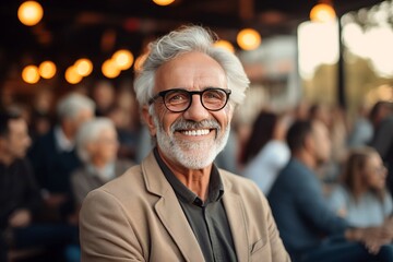 Fototapeta premium senior man smiling at an audience at event,