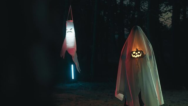 Ghost with Halloween Pumpkin Walk In The Night Forest