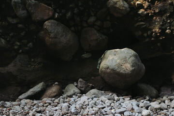 Large rocks formed by river flow visible after the water dries up
