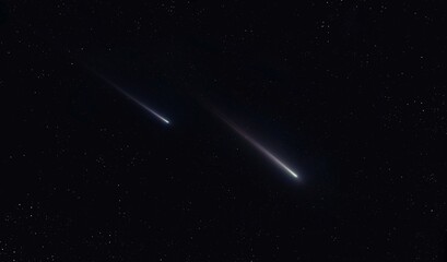 Two shooting stars. Beautiful meteors in the clear sky at night. Glow of meteorites in the dark.