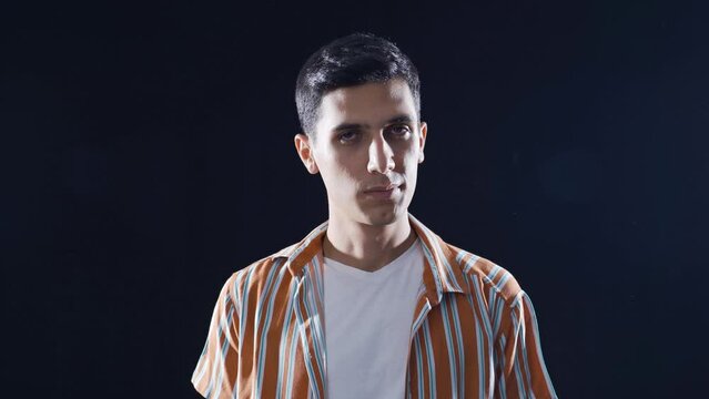 Man looking accusingly at camera.