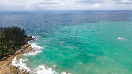 Aerial view blue sea and clouds reflection on the sea surface, natural colors, blue background