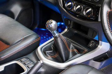 automatic transmission shift selector in the car interior. Closeup a manual shift of modern car gear shifter. 4x4 gear shift