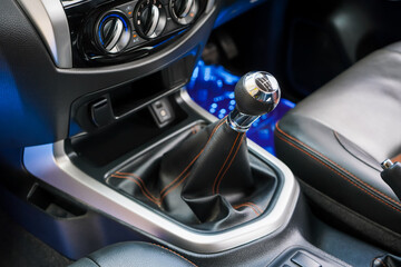 automatic transmission shift selector in the car interior. Closeup a manual shift of modern car gear shifter. 4x4 gear shift