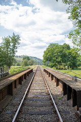 Fototapeta na wymiar Down the rail track in the Summertime.