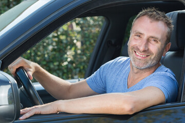 happy man in car smiling
