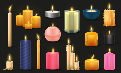Set of different sized candles isolated on a black background. A many types of colorful wax candles.
