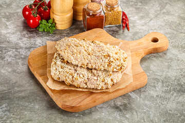 Breaded raw breaded meat schnitzel