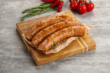 Raw sausages with spices and herbs