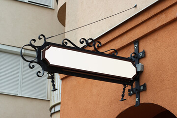 Classic signage mounted on a wall for advertising mockup. Sign template for logo, branding and...
