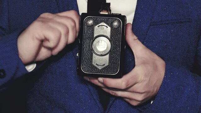 Man uses vintage camera