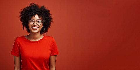 Attractive african american woman wearing red t-shirt and glasses. Isolated on red background.
