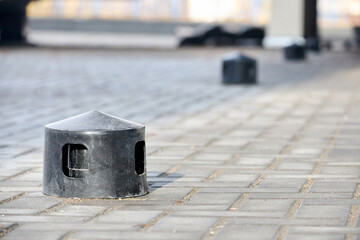Air roof exhaust ventilation fan system of commercial building with hooded plastic chimneys flues and ducts in row on on tiled roof selective focus with copyspace.