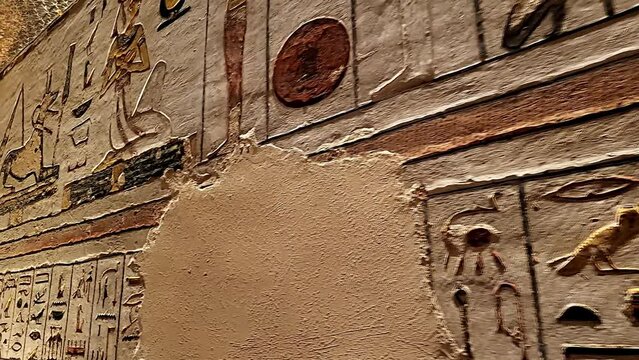 Egyptian hieroglyphs on the walls of the tombs of the pharaohs. Egyptian symbols and pharaohs writing. King's Valley. Egypt.