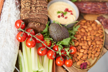 Table full of mediterranean appetizers, tapas or antipasto. Assorted Italian food set. Delicious snack on party or picnic time. Meat and cheese. Italian style banquet. 