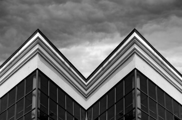 Fototapeta na wymiar View of a corner of a business building on sky background 