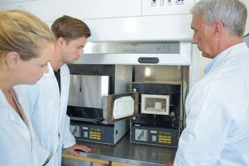 a scientist with junior apprentices