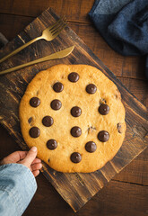 Giant chocolate chips cookie. Large and delicious homemade cookie with chunks of dark chocolate. The perfect breakfast or snack for those with a sweet tooth