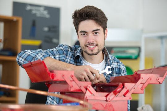 man selecting working with tool-box