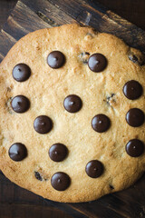 Giant chocolate chips cookie. Large and delicious homemade cookie with chunks of dark chocolate. The perfect breakfast or snack for those with a sweet tooth
