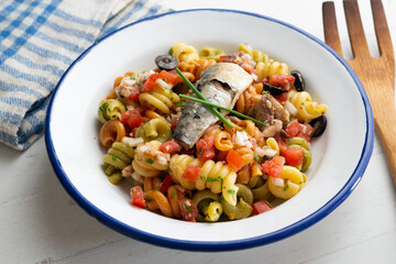 Fresh pasta with vegetables and sardines.