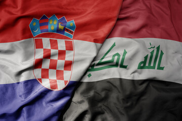 big waving national colorful flag of croatia and national flag of iraq .