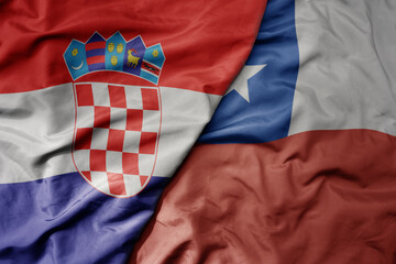 big waving national colorful flag of croatia and national flag of chile .